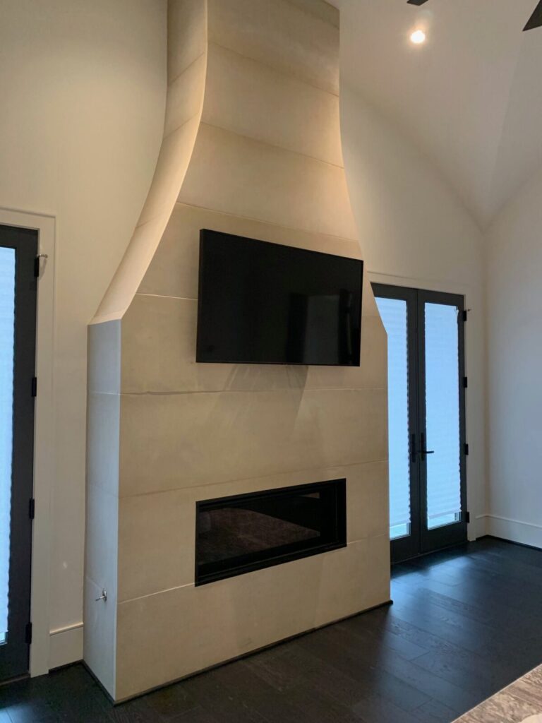 Fireplace Mounted TV in home media room, home hidden surround sound speakers