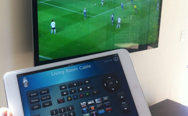 Ipad controlling a mounted flat screen tv with smart automation